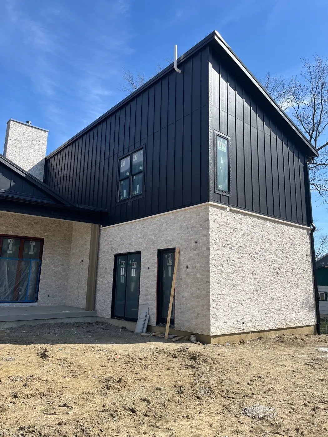 Tarping and dry-in on a Featherstone commercial roof